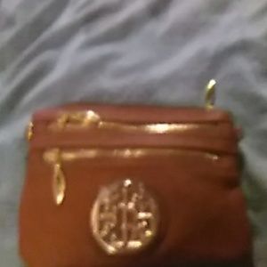 Brown wristlet or shoulder bag.